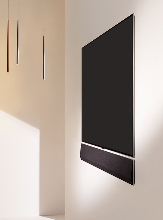 Two different angles of a wall-mounted Gallery Design with Gallery Soundbar mounted below