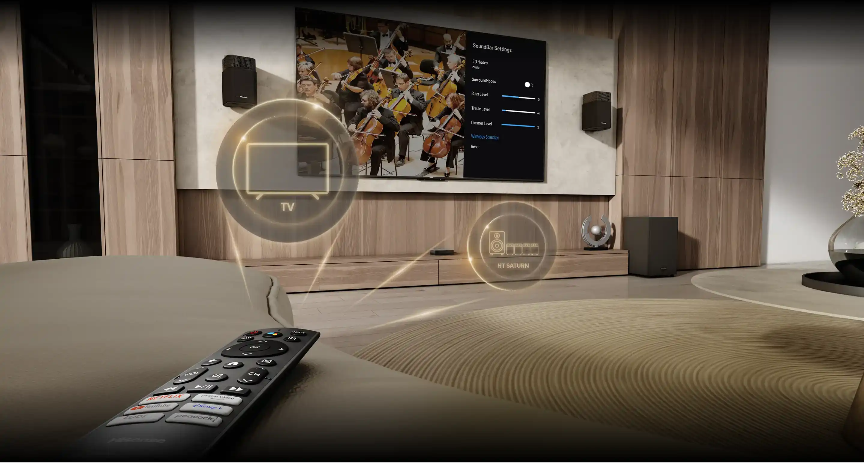 Pilot z przyciskami aplikacji leży na stole, w tle telewizor z orkiestrą i ustawieniami soundbara.