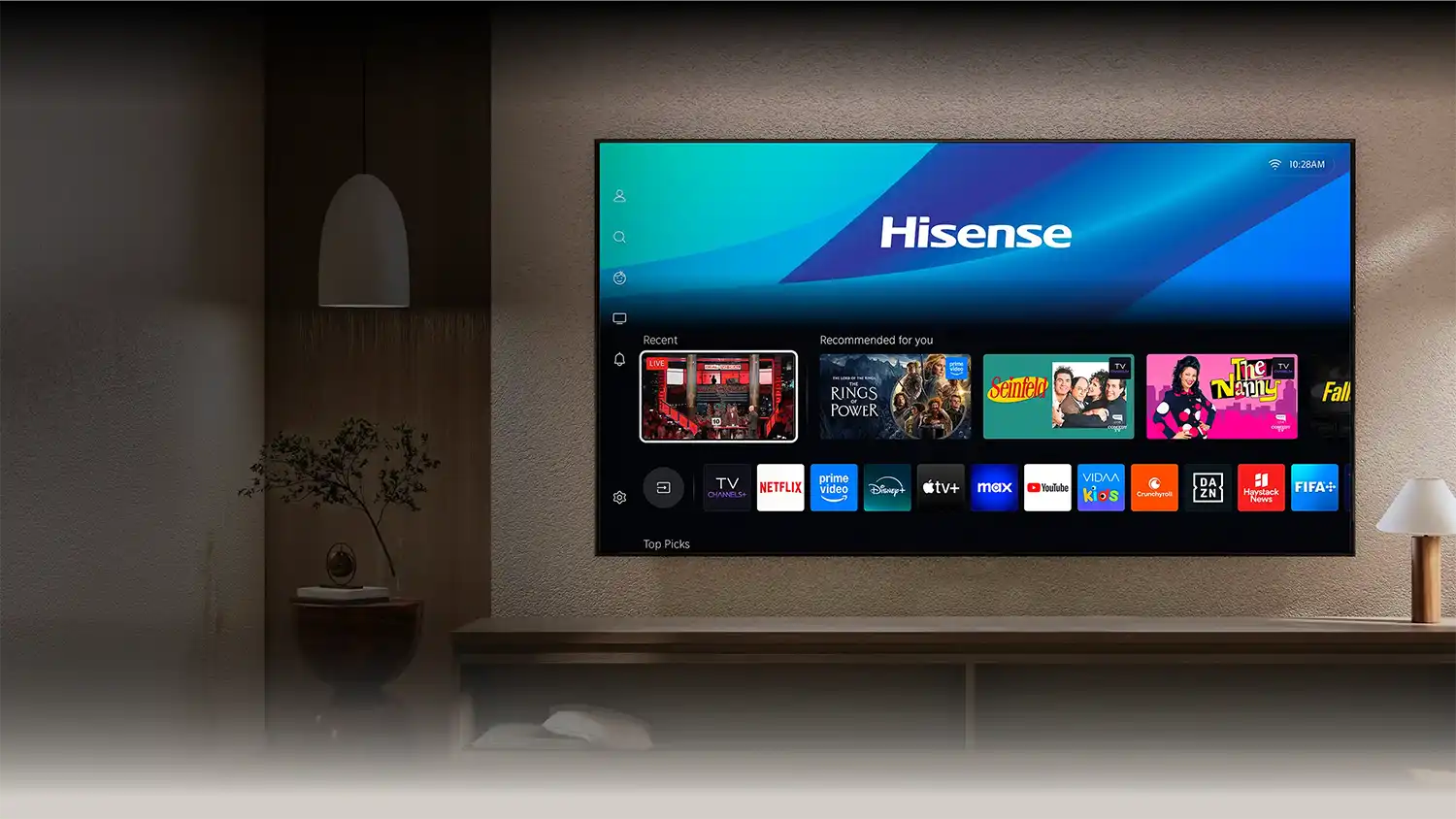 Telewizor z interfejsem, wyświetlający aplikacje streamingowe na ścianie w salonie.