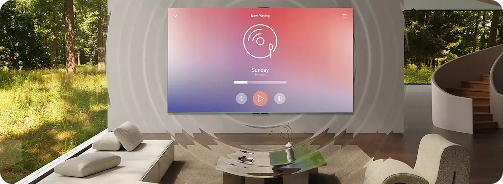 Telewizor w jasnym, nowoczesnym salonie wyświetla interfejs odtwarzacza muzyki, z wizualizacją fal dźwiękowych.