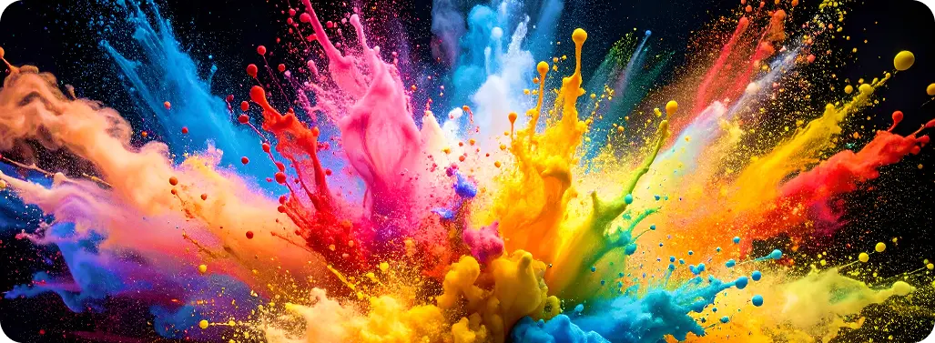 Spektakularna eksplozja kolorowego proszku, w odcieniach różu, niebieskiego, żółtego i pomarańczowego na czarnym tle.