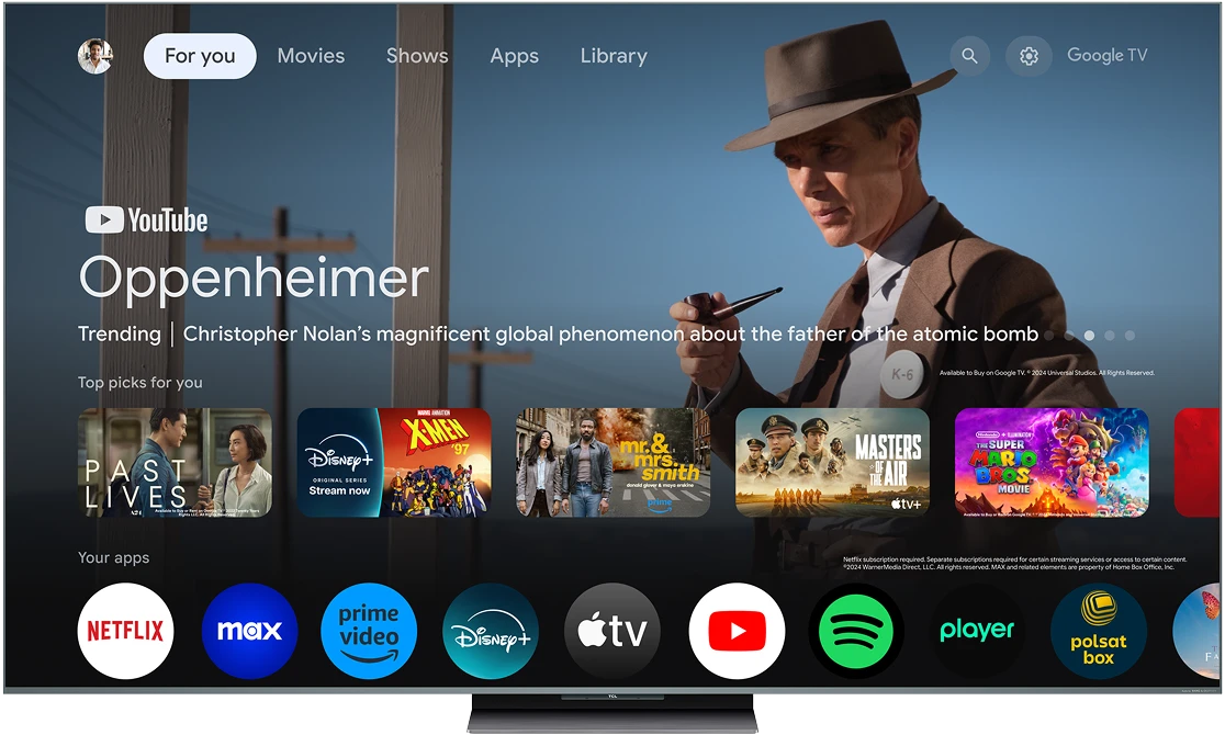 Interfejs Google Tv na telewizorze z banerem filmu Oppenheimer i rzędem ikon aplikacji Vod.