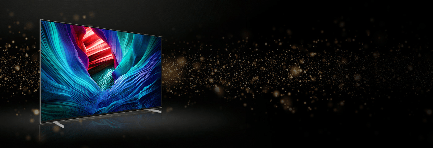 Telewizor pokazany od boku na czarnym tle ze złotymi elementami.