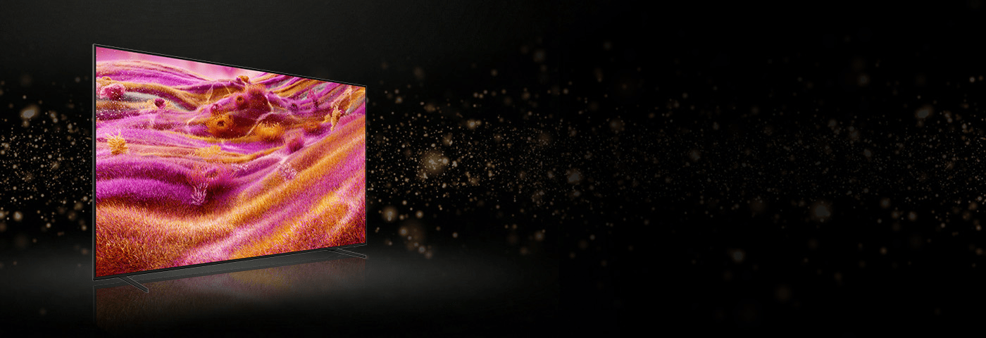 Telewizor pokazany z ukosa z ekranem w wyrazistych, różowo-pomarańczowych odcieniach.