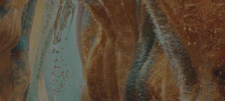 Mechate ściany w kolorze pomarańczowym, na które spływa przezroczysta ciecz.