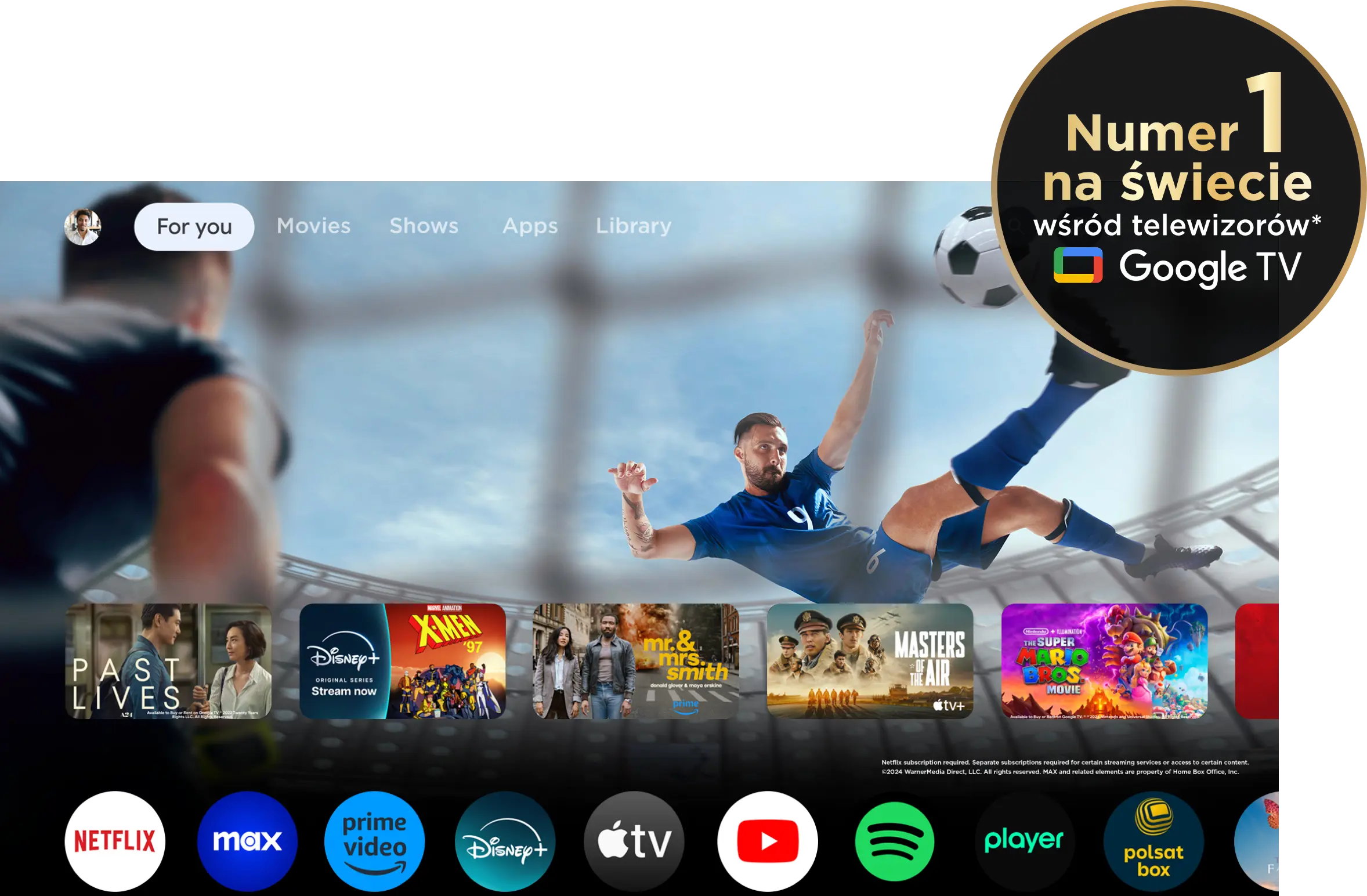 Interfejs Google Tv z kafelkami filmów, ikonami serwisów i informacją o pozycji lidera rynku.