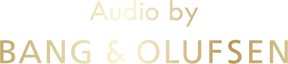 Złoty, metaliczny logotyp z napisem Audio by Bang & Olufsen, symbolizujący luksus.