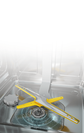 Dwie dysze w kolorze srebrno-żółtym wewnątrz pustej zmywarki. Poniżej resztki wody odprowadzane są do odpływu.