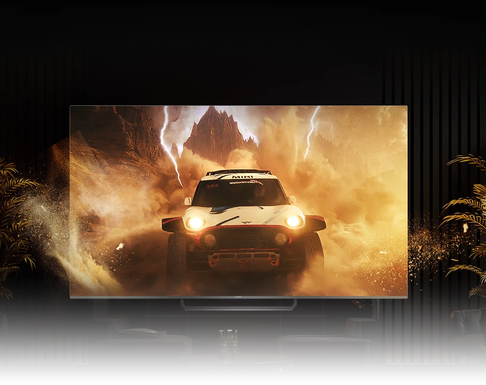Telewizor Haier wyświetlający dynamiczną scenę samochodu terenowego w pustynnym krajobrazie