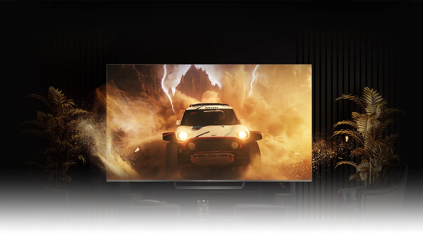 Telewizor Haier wyświetlający dynamiczną scenę samochodu terenowego w pustynnym krajobrazie