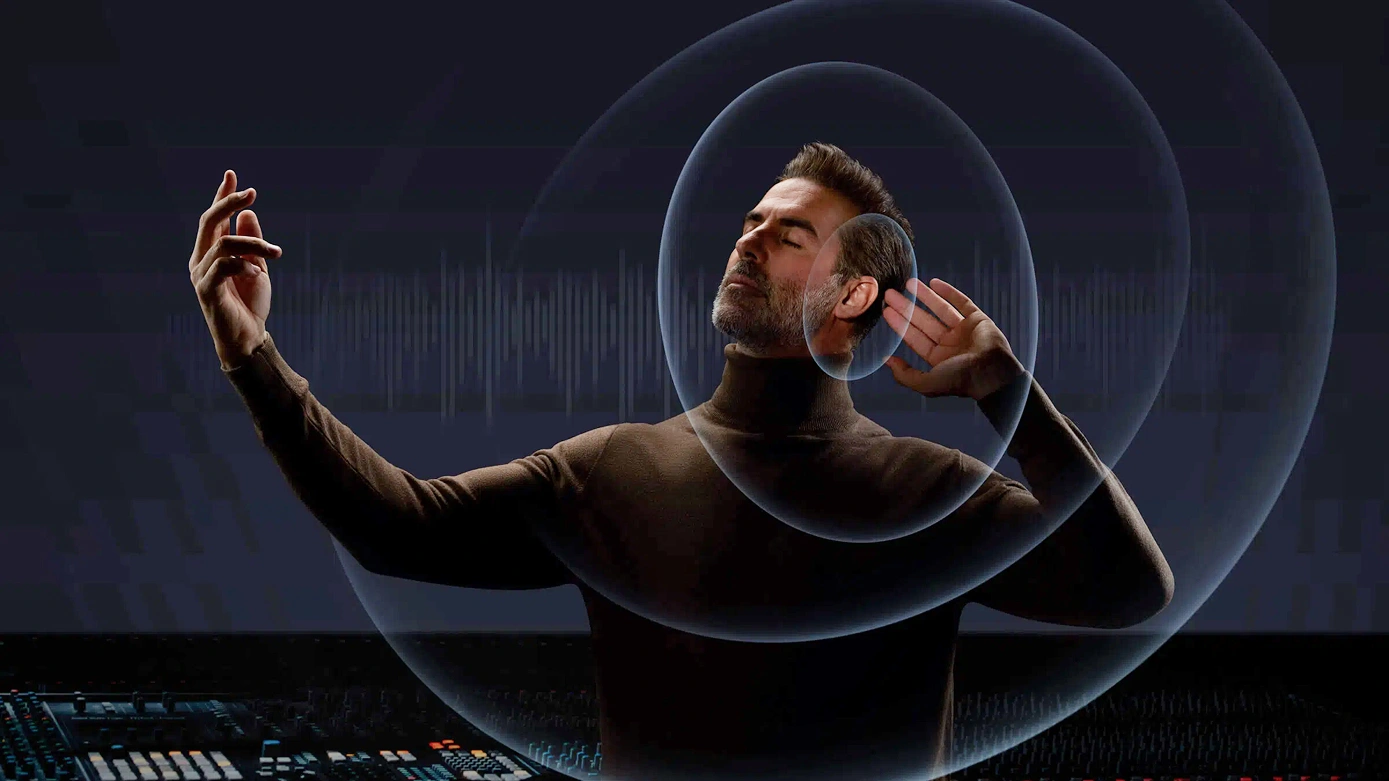 Mężczyzna z zamkniętymi oczami w skupieniu słucha muzyki, otoczony wizualizacją fal dźwiękowych