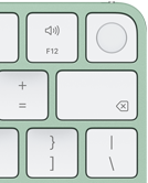Klawiatura Magic Keyboard, prawy górny róg, kolor zielony, czytnik Touch ID, klawisz Delete i klawisze regulacji głośnościi